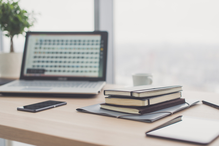 Documents on office table with pen and digital tablet as work space business concept.の写真素材