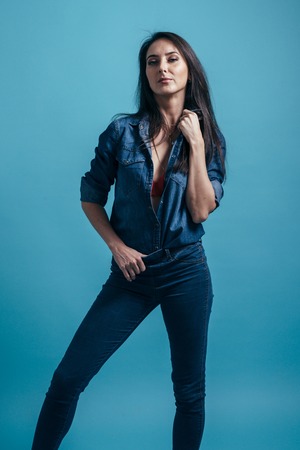 Portrait of young stylish fashion glamorous sexy brunette woman Jeans clothing.の写真素材