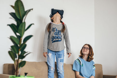 Child with virtual reality headset at home