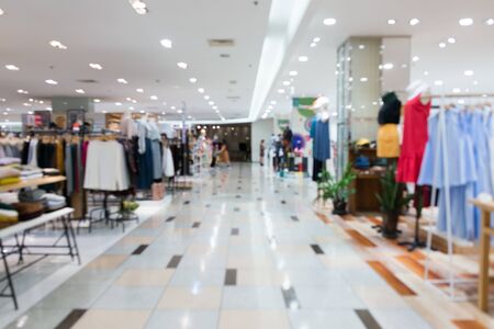 Blurred showcases fashion boutique Clothing store in a modern shopping mall. Cloth and acessorie modern shop blur background.の写真素材