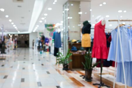 Blurred showcases fashion boutique Clothing store in a modern shopping mall. Cloth and acessorie modern shop blur background.の写真素材