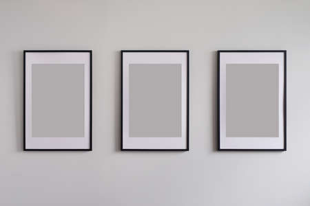 Three blank frames on wallの写真素材