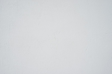 Clear concrete textured painted white wall