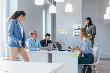 Colleagues during meeting in office. Business professionals collaboratingの写真素材