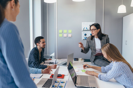 Businesspeople having a discussion in a meeting room.