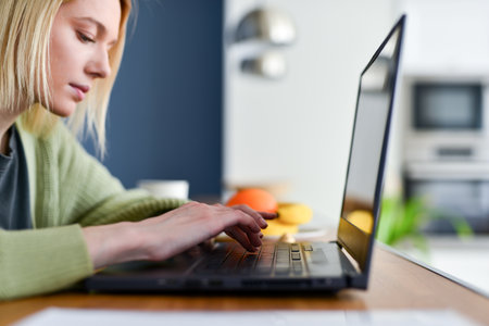 Woman with laptop at homeの写真素材