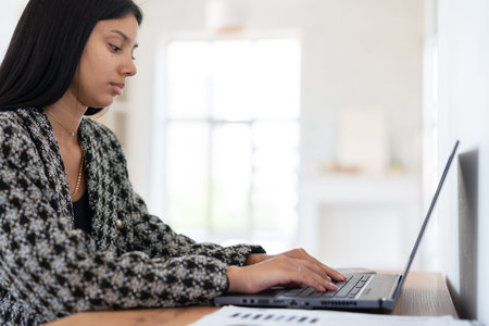 Student doing home work with laptop