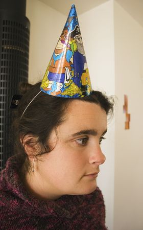 Woman has a contemplative thought at a partyの写真素材