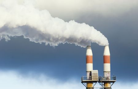 Pipes spewing steam on a stormy dayの写真素材