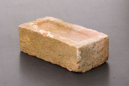 An old brick on dark backgroundの写真素材