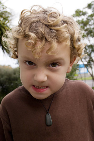 young caucasian boy pulling facesの写真素材