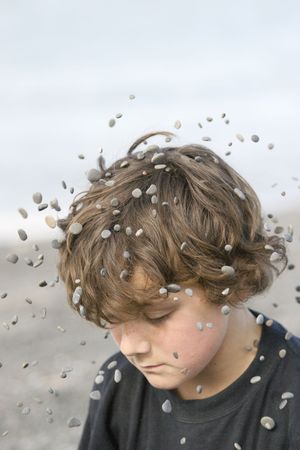 Stones in orbit around boyの写真素材