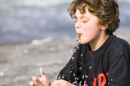 Boy playing with stones and gravity