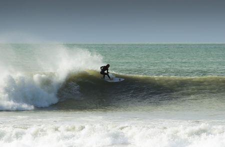 Surfing the break at Haumoana Beach, Hawke's Bay, New Zealandの写真素材