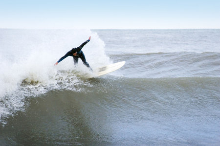 Surfing the break at Haumoana Beach, Hawke's Bay, New Zealand