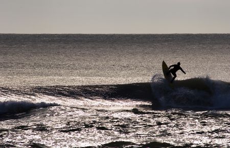Surfing the break at Haumoana Beach, Hawke's Bay, New Zealandの写真素材