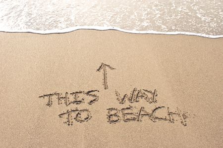 This way to beach written in the sand at Haumoana Beach, Hawke's Bay, New Zealandの写真素材