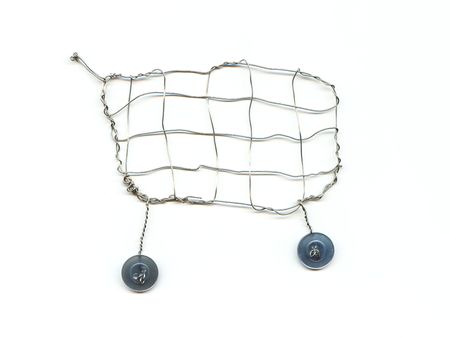 A shopping cart made from wire and buttonsの写真素材