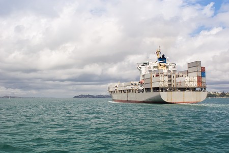 A ship leaves Auckland Harbour in the Hauraki Gulf, New Zealandの写真素材