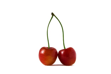 Double red sweet cherry on a white backgroundの写真素材