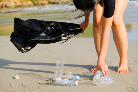 people keeping garbage of plastic bottle on the beach