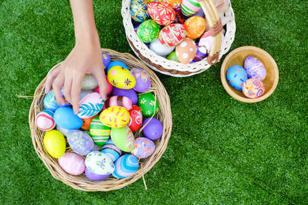 Colorful easter eggs in Basketの写真素材