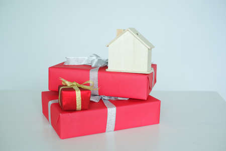 red present box and a dream to buy a house as a gift conceptの写真素材