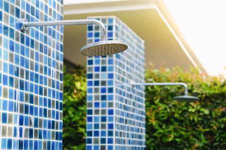 take a shower head for swimming in outdoorの写真素材