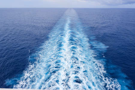wave ocean view from balcony of behind the cruise shipの写真素材