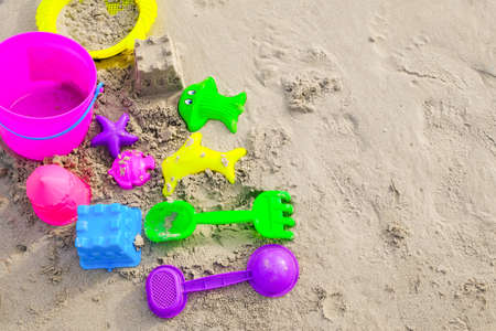 kids beach bucket toys or sand box on tropical sand beachの写真素材