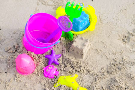 kids beach bucket toys or sand box on tropical sand beachの写真素材