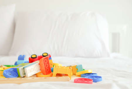 colorful plastic toys on bedの写真素材