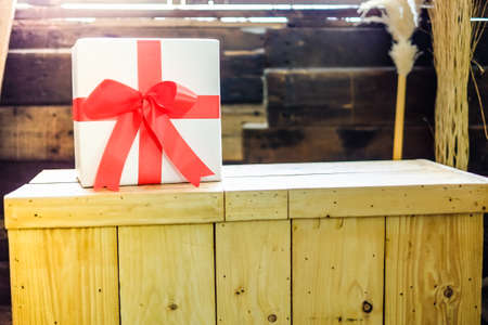 white gift box and red ribbonの写真素材