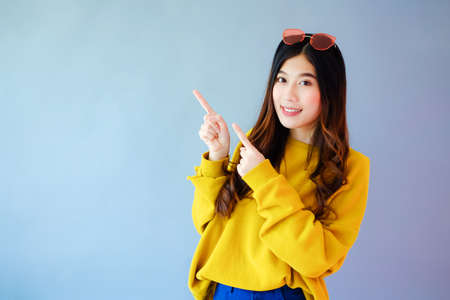 portrait asian woman wearing long sleeve clothes on background with fashion sunglass, Winter fashion setの写真素材