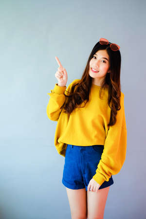 portrait asian woman wearing long sleeve clothes on background with fashion sunglass, Winter fashion setの写真素材