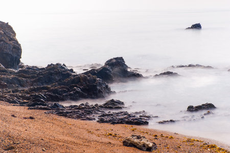 Long exposure tropical rocky beach