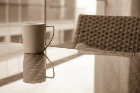 white coffee cup with outdoor view , sepia toneの写真素材