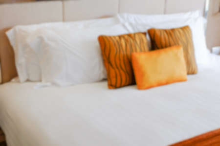 blur pillows on bed and in bedroomの写真素材