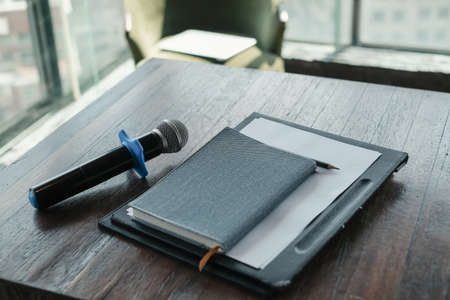 Close up equipment microphone notebook on tableの写真素材