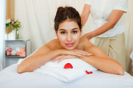Young woman brunette skin relaxing in spa massageの写真素材