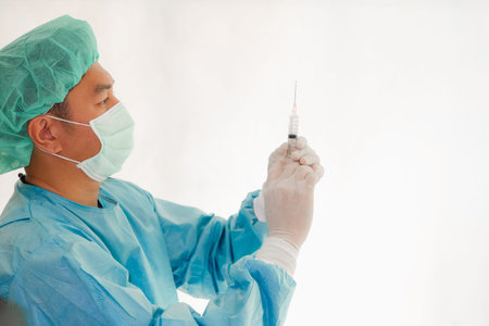 Doctor asian man dressed in surgical uniform