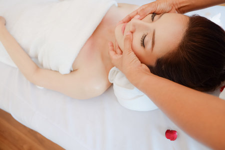 Young asian woman relaxing in spa massageの写真素材