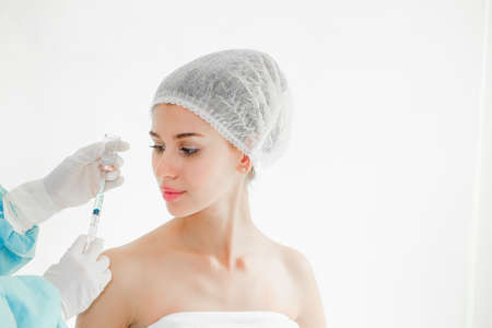 The doctor is examining woman undergo surgery, beauty conceptの写真素材