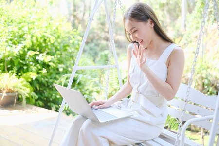 Asian woman playing or working with laptopの写真素材