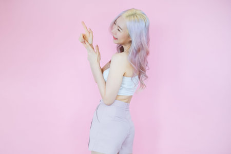 posing beautiful asian woman posing on pink background, emotions action, beauty concept