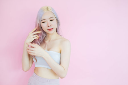 posing beautiful asian woman posing on pink background, emotions action, beauty concept