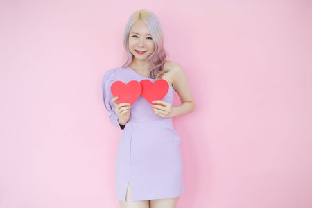 Portrait beautiful asian woman on pink background, happy valentine day in love concept, model...