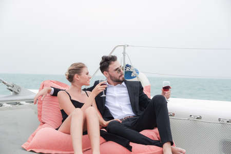 Portrait caucasian couple in love romance on luxury white yacht in the seaの写真素材