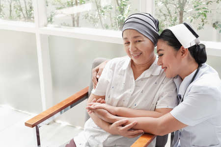 asian Female nurses take care of senior woman at homeの写真素材