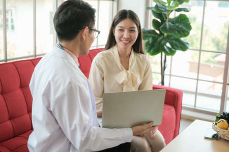 Professional nutritionist asian man consulting asia woman in clinic or hospital or medical clubの写真素材